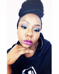 Toni Daley Black woman with wearing makeup and a black headwrap